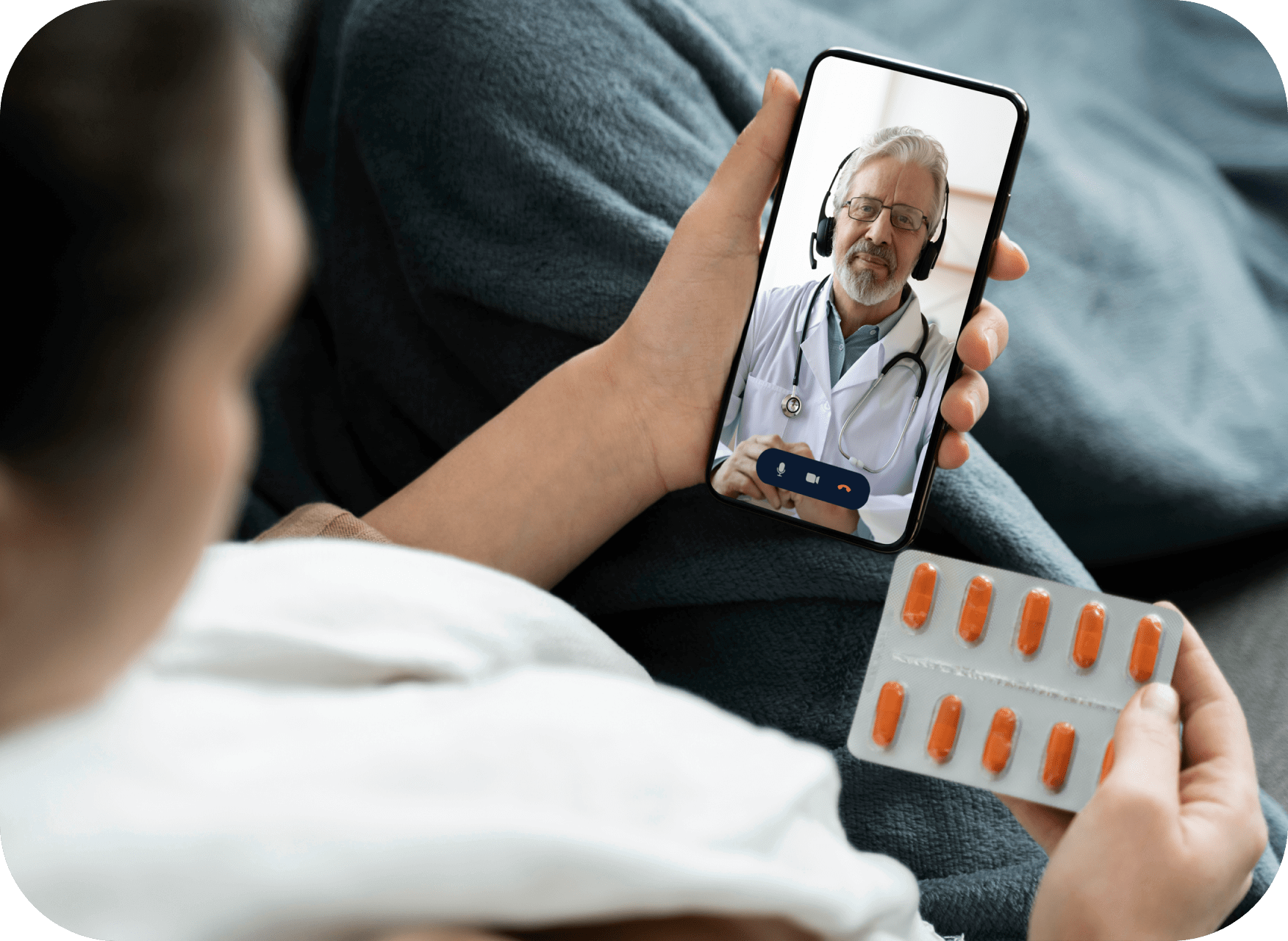 Woman holding tablet with pills, watching doctor on screen.